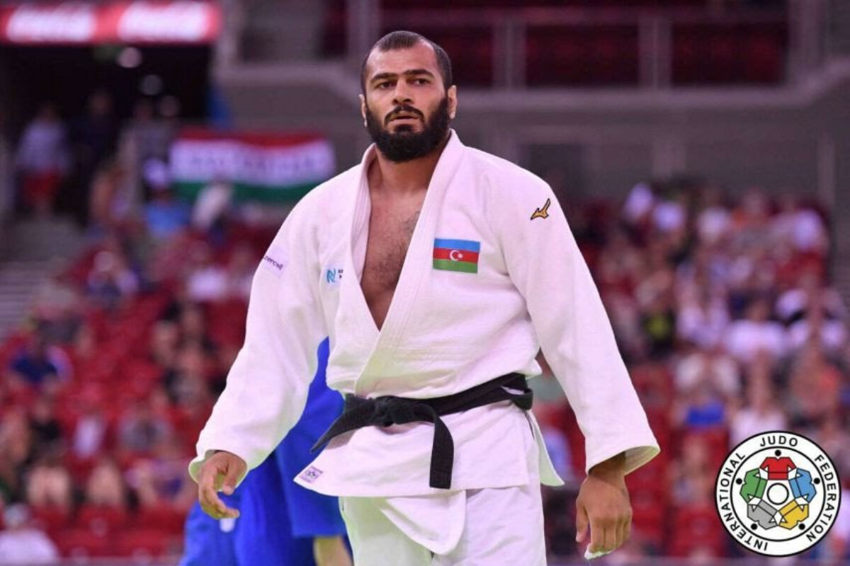 <p>Elmar Qasımov tatamiyə dönərək çempion olub</p>